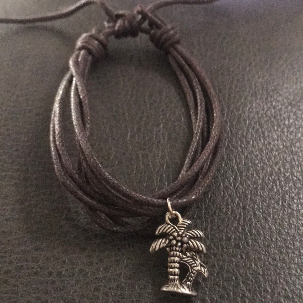 NWOT MULTI LAYER BRACELET WITH PALM TREE CHARM